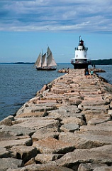 Sailboat Passes by Spring Point Lighthouse in Maine